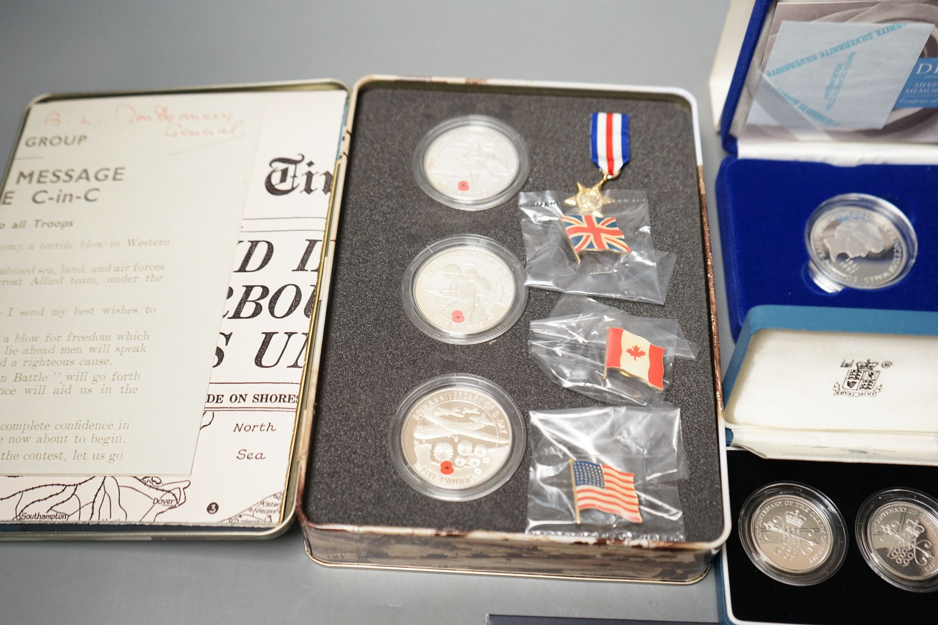 Cased Royal Mint UK proof coins – a Diana Memorial silver coin, a Millennium £5, a D-day 3 coin silver medal set, a 1992 two coin 10p set and a 1989 two coin £2 set